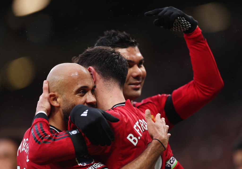 Bruno Fernandes celebrates scoring with teammates Bryan Mbeumo and Casemiro during the Premier League match between Manchester United and Tottenham Hotspur at Old Trafford in 2026 in Manchester, England.