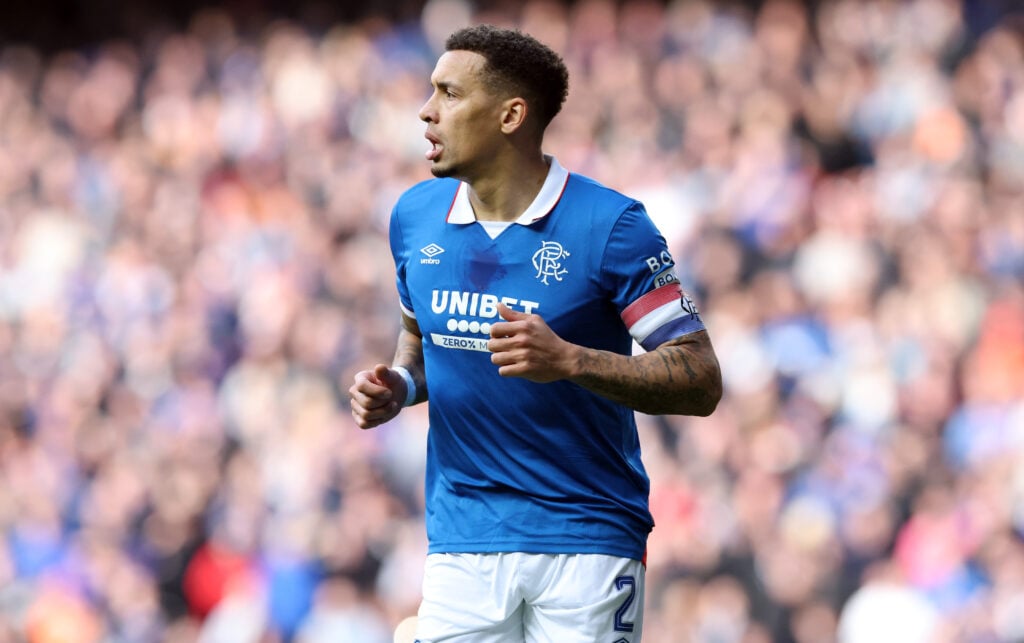 James Tavernier looks on.