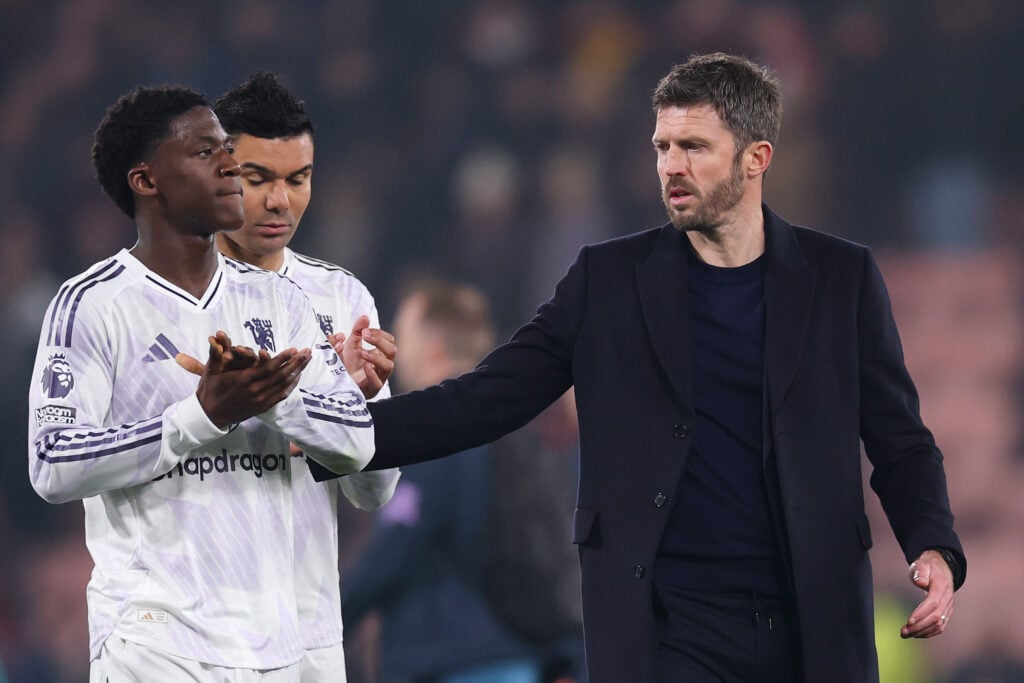 Michael Carrick sharing a moment with Kobbie Mianoo