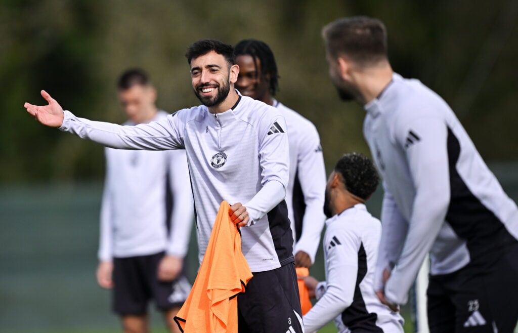 Bruno Fernandes holding an orange bib in training