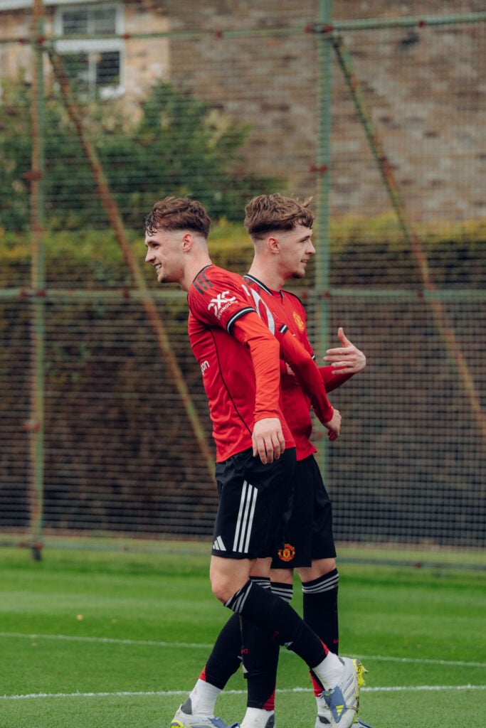 Jack Fletcher and Tyler Fletcher celebrate Manchester United goal.