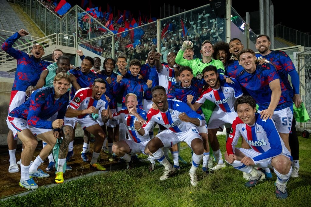 Crystal Palace players celebrate after beating Fiorentina on aggregate in the Conference League quarter-finals.