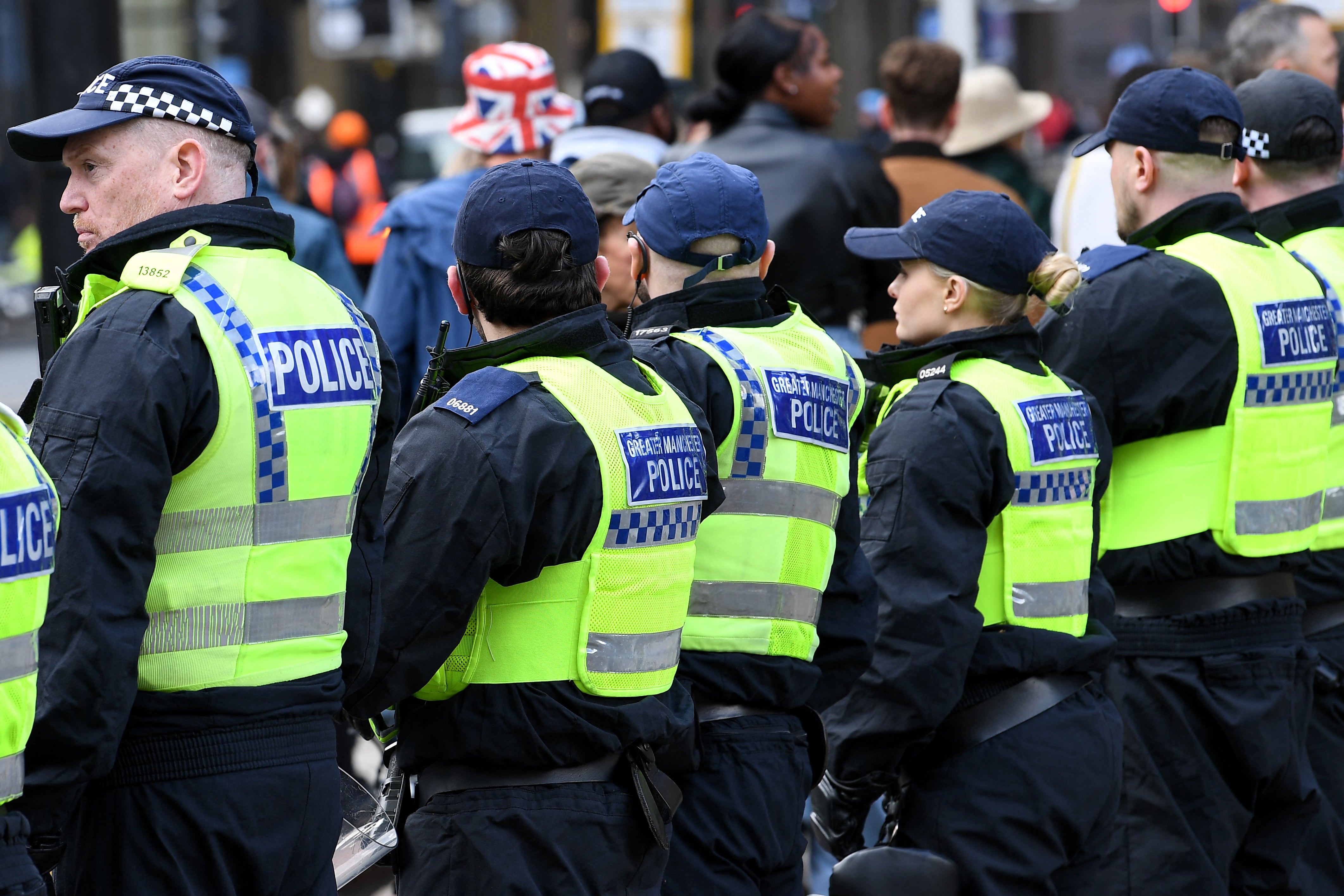 Police officers form a line during a Britain First march in Manchester