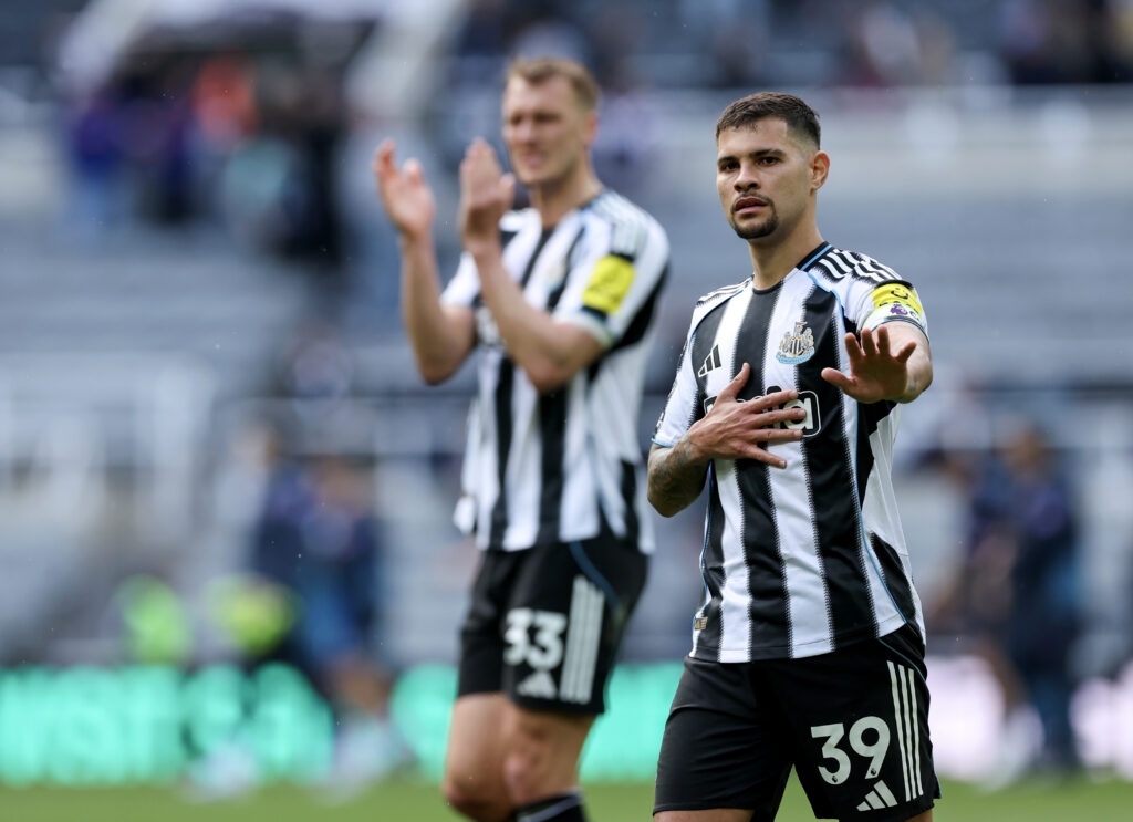 Bruno Guimaraes holds his hands up to fans after Newcastle United lose to Bournemouth.