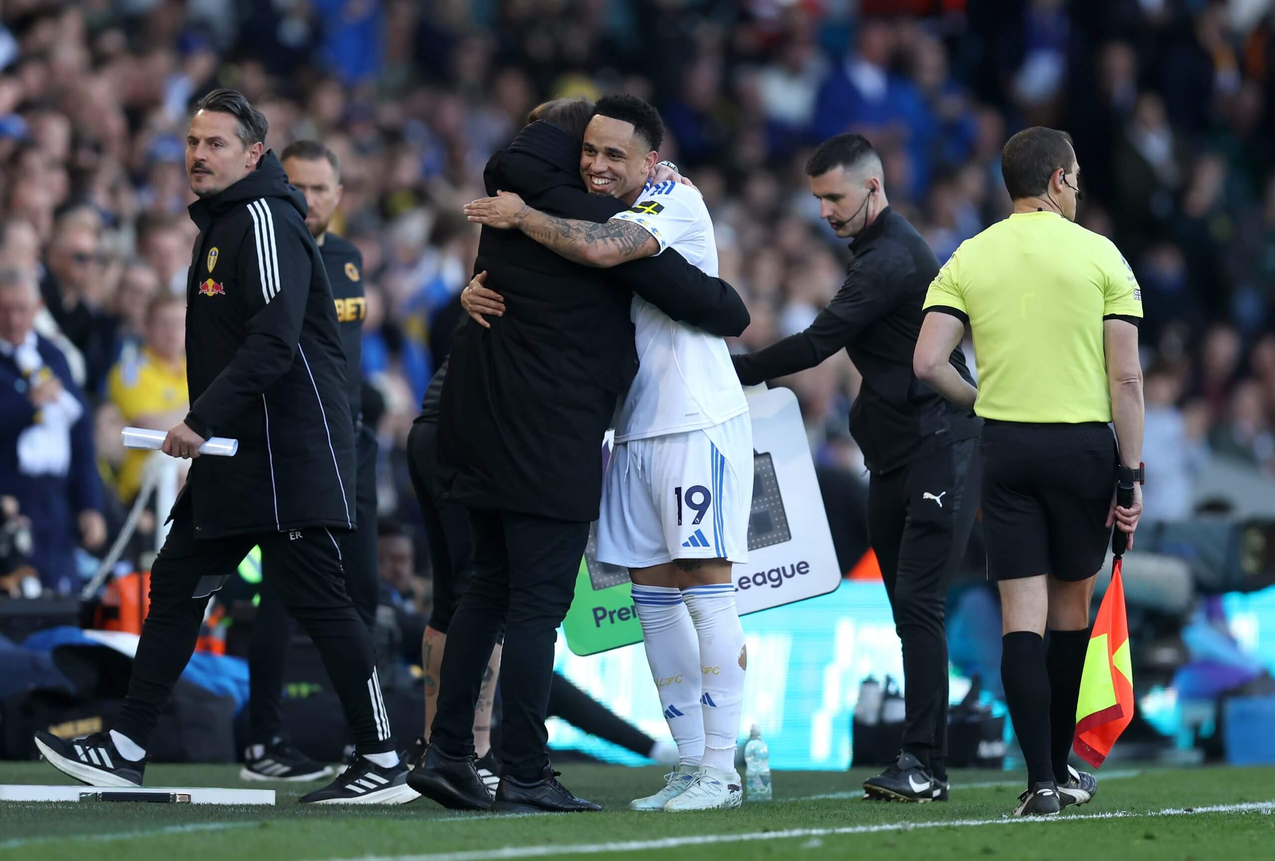 Noah Okafor hugs his Leeds manager Daniel Farke on the touchline at Elland Road