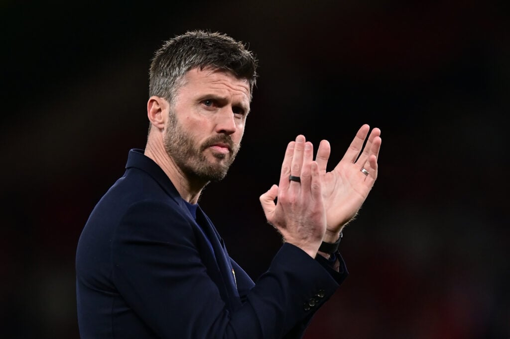 Michael Carrick applauds the fans at the end of the Premier League match between Manchester United and Brentford at Old Trafford in 2026 in Manchester, England.