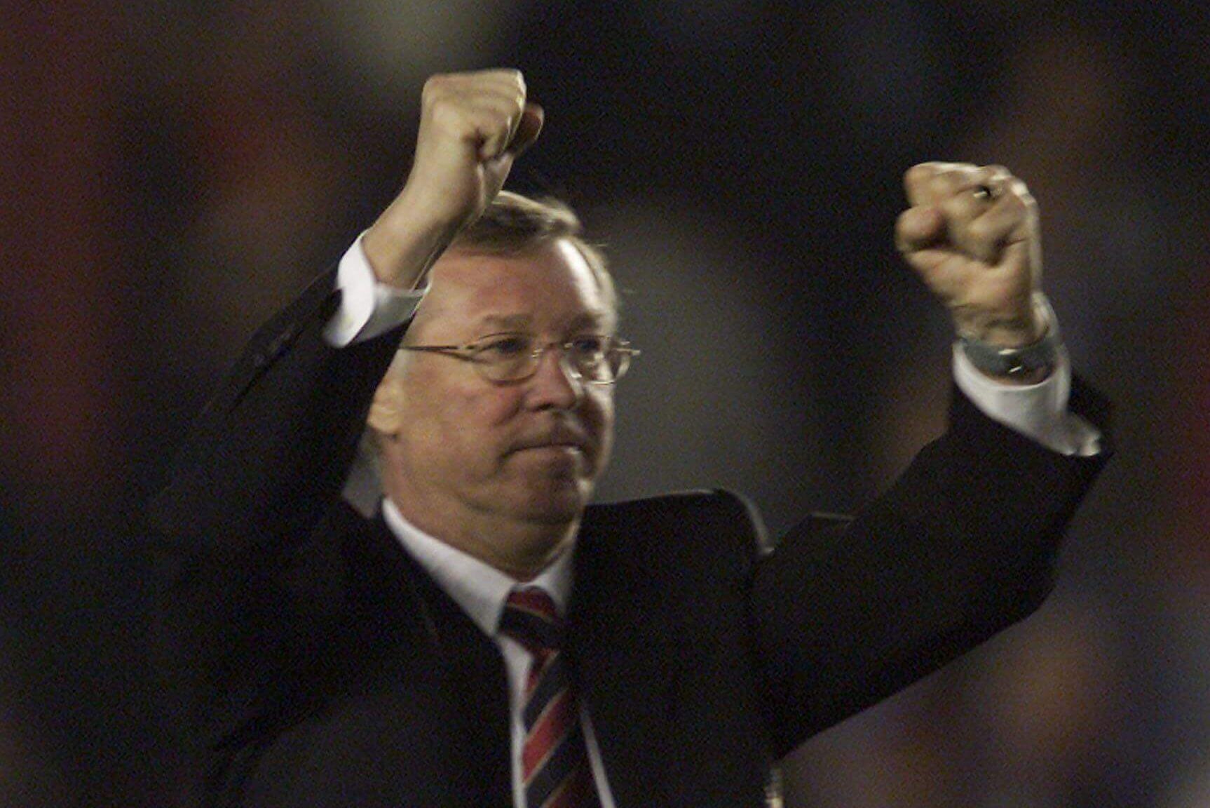 Alex Ferguson hoists both fists in the air