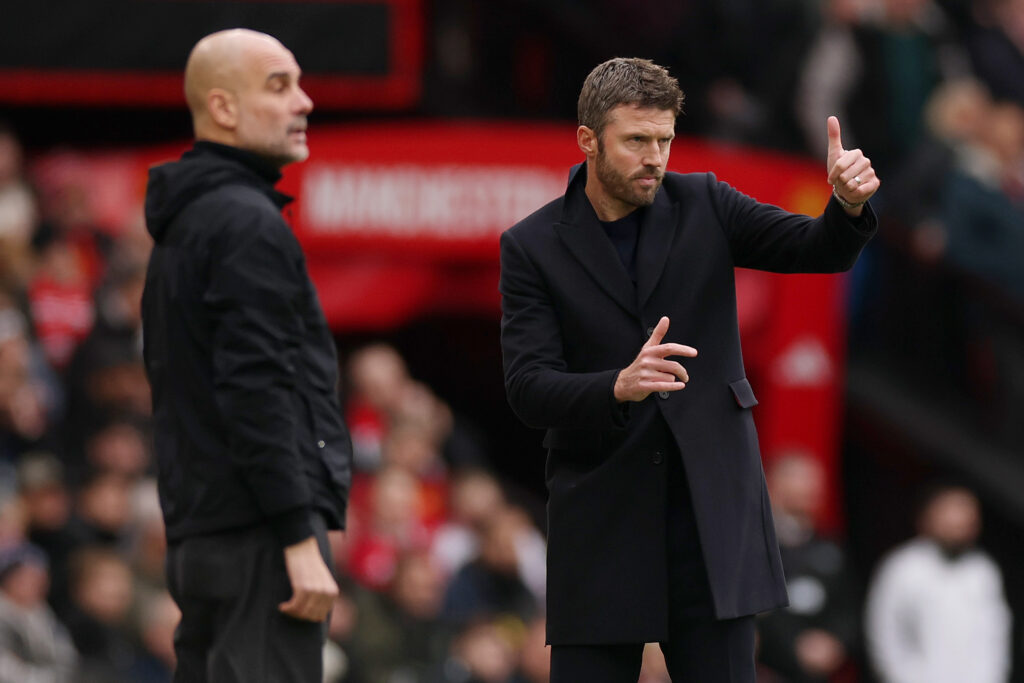 Michael Carrick gestures from the touchline at Old Trafford.