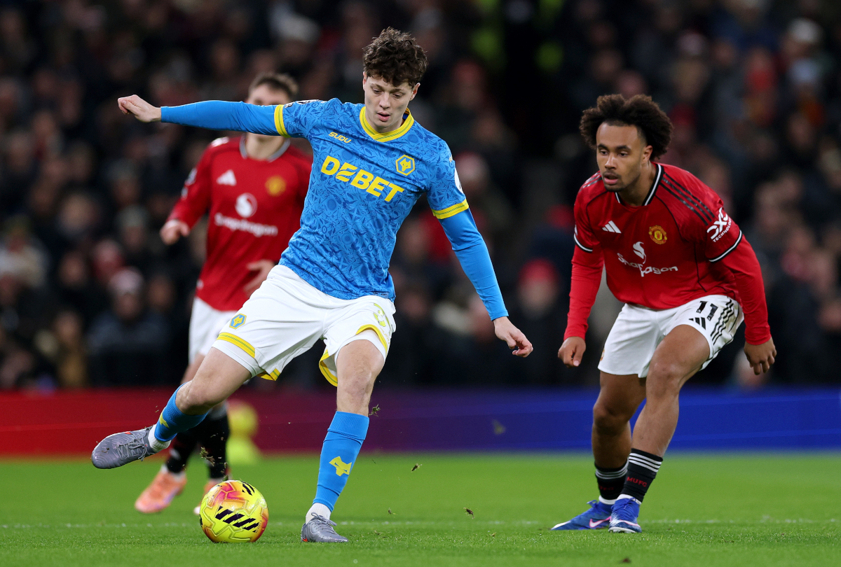 MANCHESTER, ENGLAND - DECEMBER 30: Ladislav Krejci of Wolverhampton Wanderers passes the ball whilst under pressure from Joshua Zirkzee of Manchester United during the Premier League match between Manchester United and Wolverhampton Wanderers at Old Trafford on December 30, 2025 in Manchester, England. (Photo by Michael Regan/Getty Images)