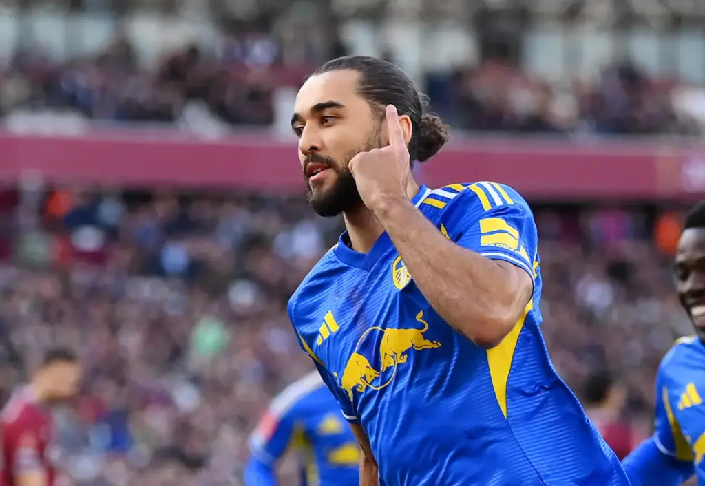 Dominic Calvert-Lewin cups his ear while celebrating scoring a penalty for Leeds United