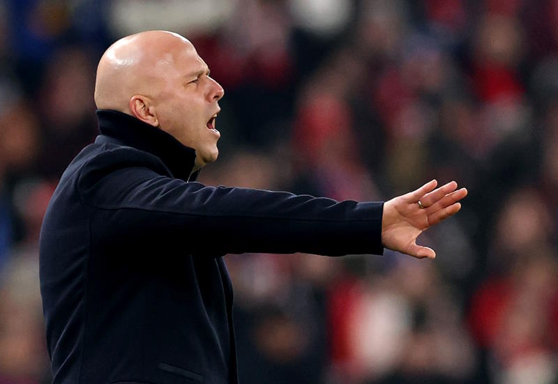 Liverpool manager Arne Slot gestures to his players