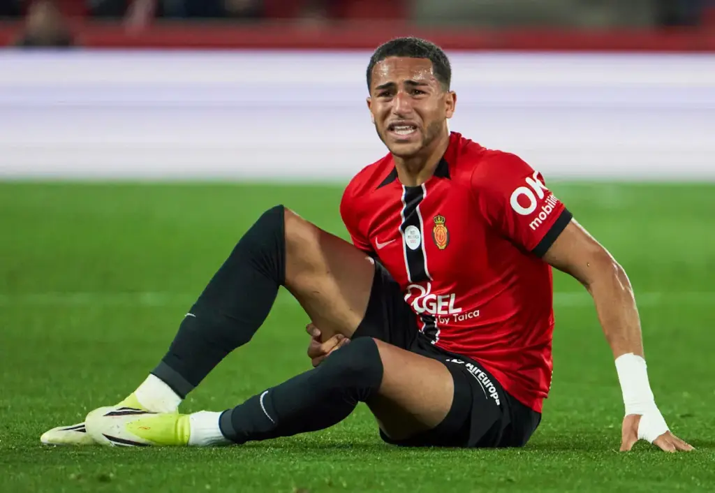 Mateo Joseph clutches his leg in pain while playing for Mallorca