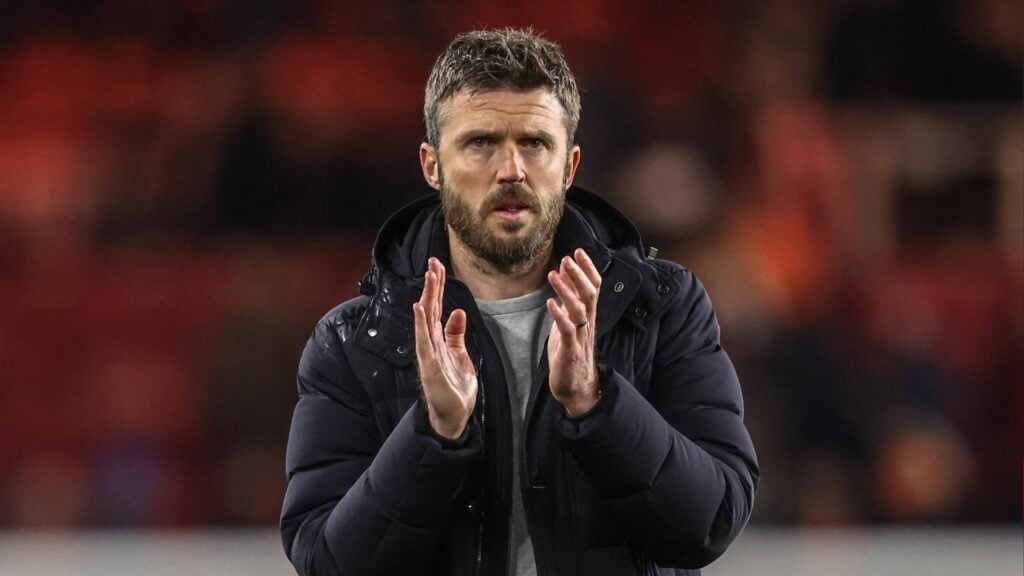 Manchester United-linked manager Michael Carrick applauds after a game.