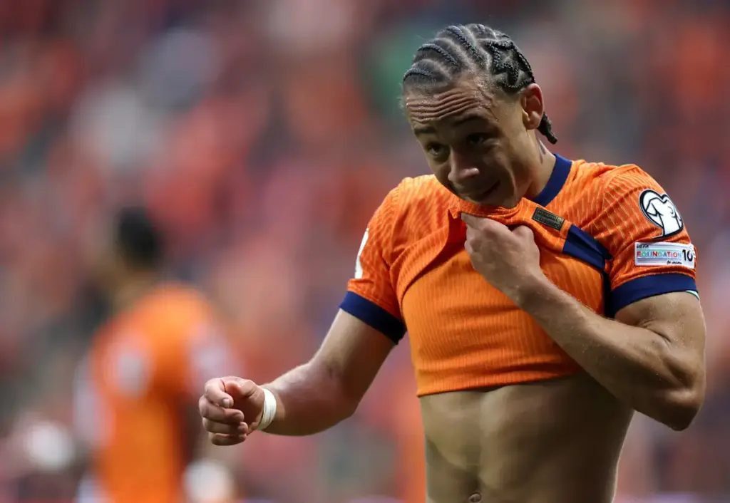 Xavi Simons reacts while playing for the Netherlands, pulling his shirt up