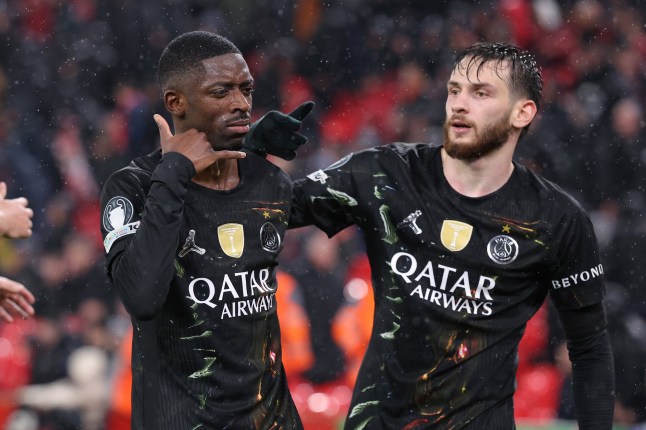 LIVERPOOL, ENGLAND - APRIL 14: Ousmane Dembele of Paris Saint-Germain celebrates with Khvicha Kvaratskhelia after scoring their second goal during the UEFA Champions League 2025/26 Quarter-Final Second Leg match between Liverpool FC and Paris Saint-Germain FC at Anfield on April 14, 2026 in Liverpool, England. (Photo by Alex Livesey - Danehouse/Getty Images)