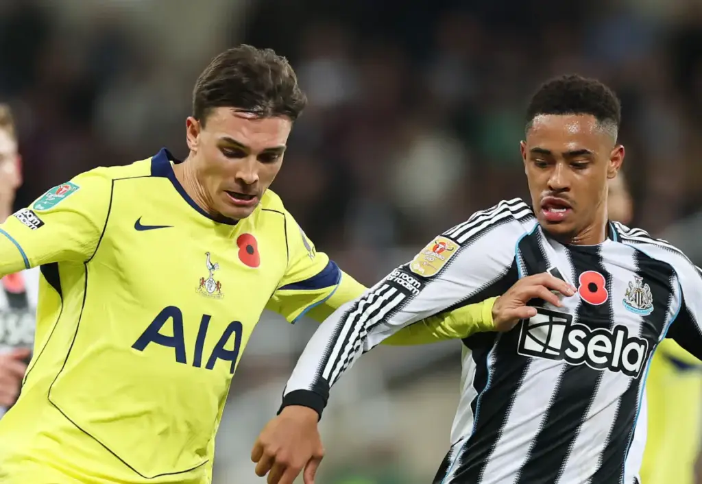 Newcastle United midfielder Jacob Ramsey battles Tottenham's Joao Palhinha for the ball
