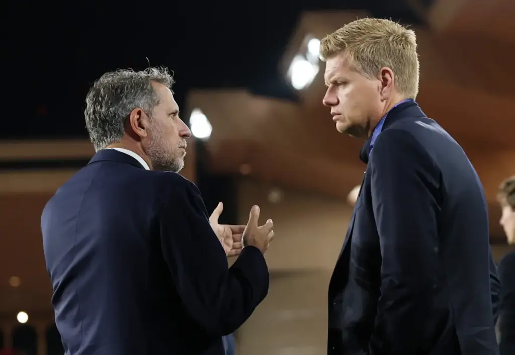 Fabio Paratici speaks to Johan Lange before a Tottenham Hotspur match