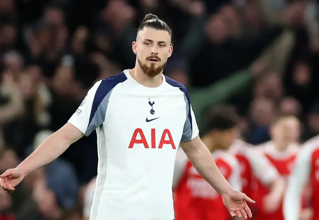 Radu Dragusin holds out his arms in frustration after Tottenham Hotspur concede a goal