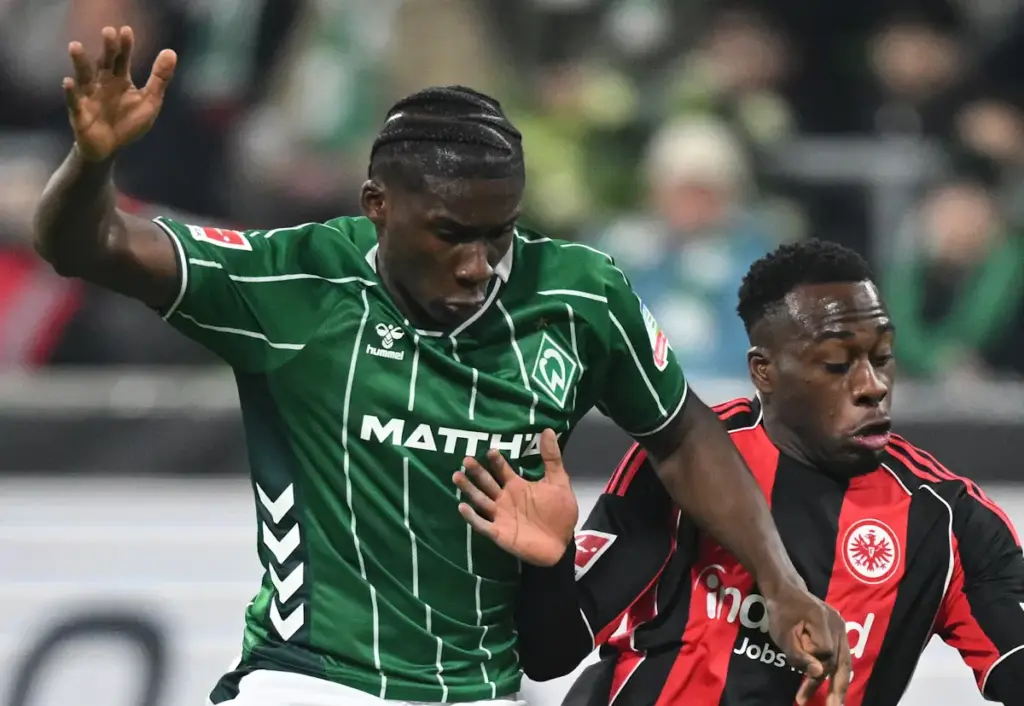Werder Bremen defender Karim Coulibaly battles for the ball