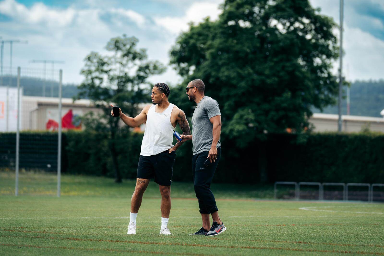 Noah Okafor talks with Rolf Fongue during a fitness session
