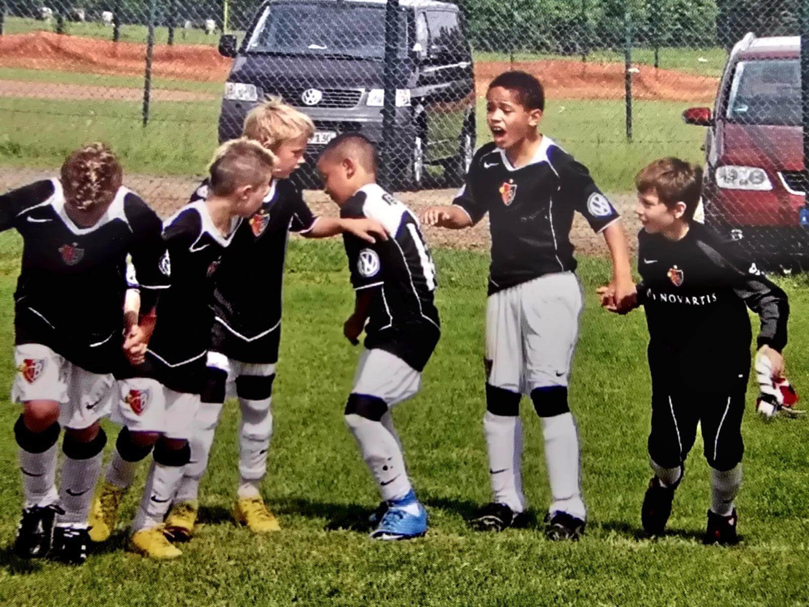 A young Okafor celebrates with his team-mates at a youth game