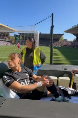 Xavi Simons was caught on camera yelling “F**K YOU” to a Wolves fan as he was taken away for medical treatment