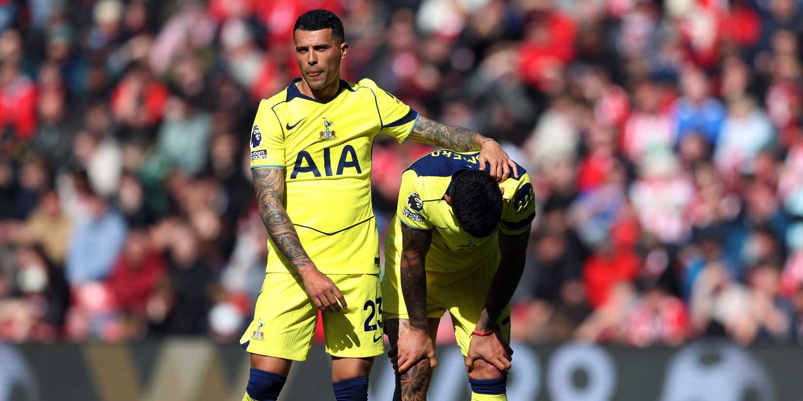  A dejected Tottenham Hotspur's Cristian Romero is consoled by Pedro Porro