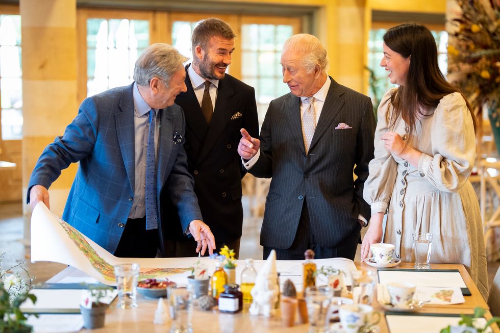 Alan Titchmarsh, Sir David, the King and Frances Tophill look at the designs
