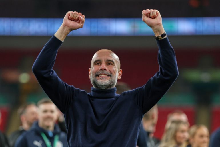 Manchester City's head coach Pep Guardiola celebrates after his team won the English League Cup final soccer match between Arsenal and Manchester City in London, Sunday, March 22, 2026. (AP Photo/Richard Pelham)