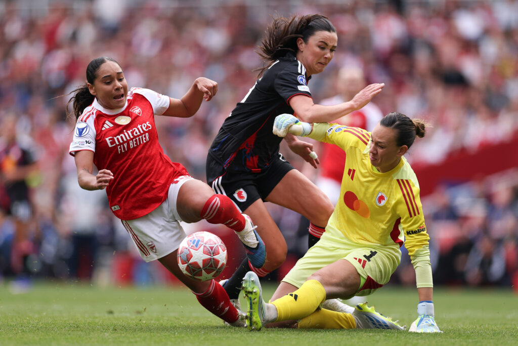 Olivia Smith steals the ball from the Lyon goalkeeper and centreback
