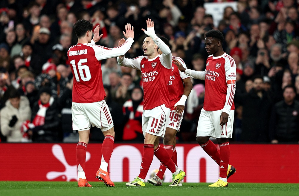 Gabriel Martinelli of Arsenal celebrates scoring his team's second goal with teammates Christian Norgaard and Bukayo Saka during the Emirates FA Cup Fourth Round match between Arsenal and Wigan Athletic on February 15, 2026 in London, England. (Photo by James Fearn/Getty Images)