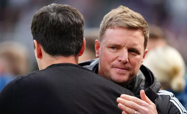 Bournemouth manager Andoni Iraola, left and Newcastle United manager Eddie Howe gesture, ahead of the English Premier League soccer match between Newcastle United and Bournemouth, in Newcastle, England, Saturday, April 18, 2026. (Owen Humphreys/PA via AP)