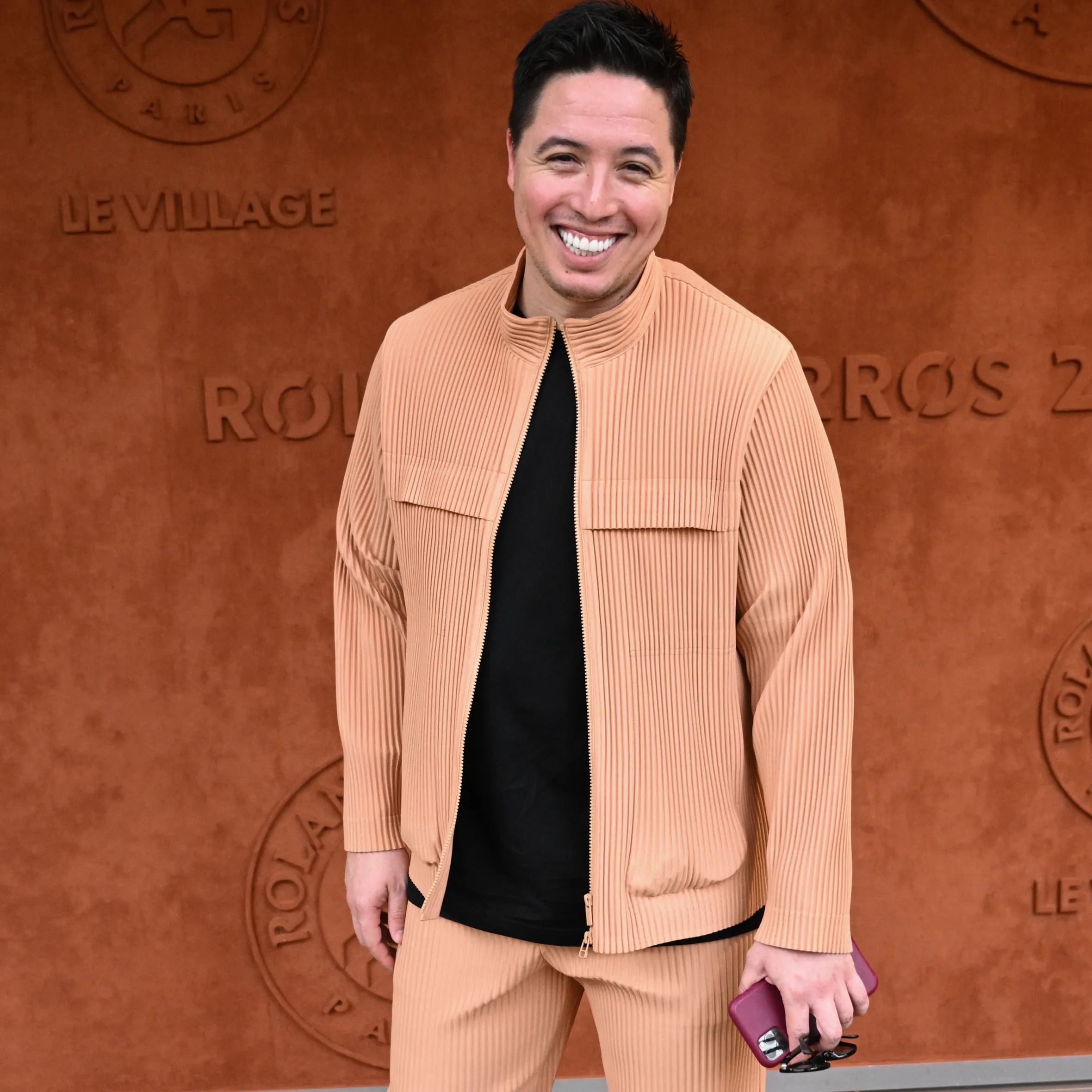 Samir Nasri smiles while attending the French Open.