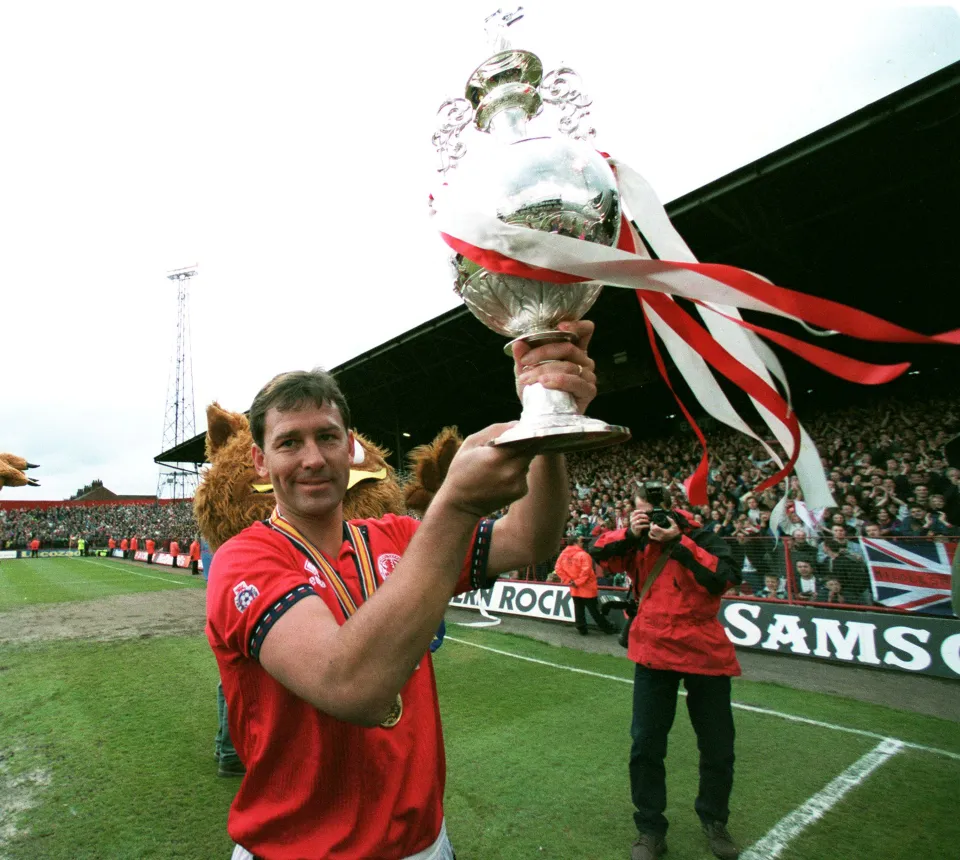 Bryan Robson of Middlesbrough celebrates with Ist Division Trophy after the Football League First Division match between Middlesbrough and Luton Town at Ayresome Park on April 30, 1995