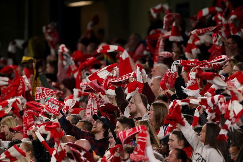 LONDON, ENGLAND - APRIL 01: Fans of Arsenal wave their scarves to show support for their team during the UEFA Women's Champions League 2025/26 Quar...