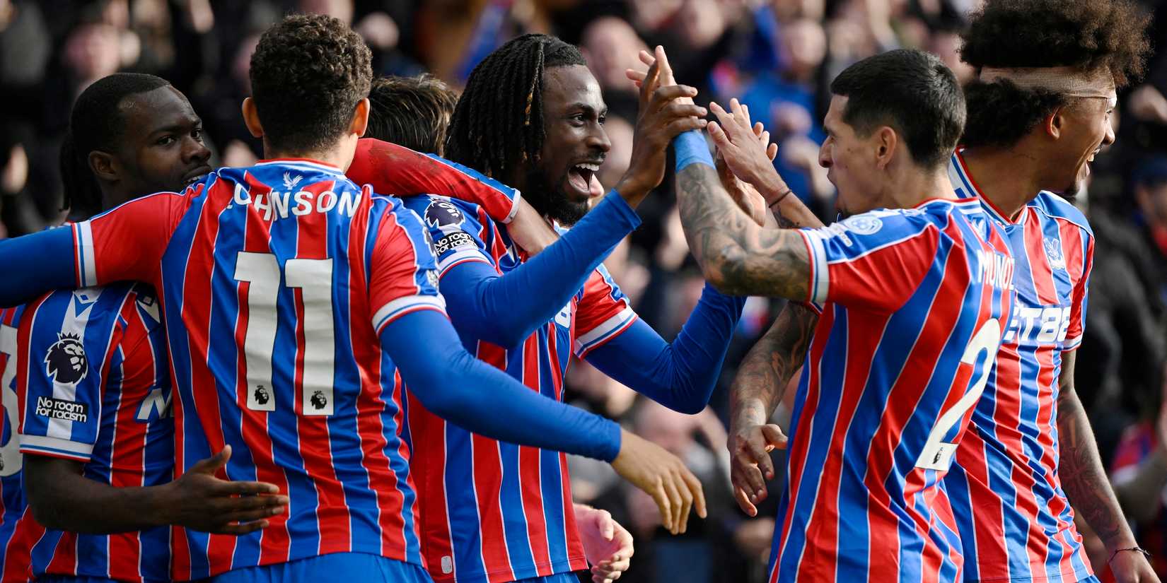 Crystal Palace's Evann Guessand celebrates scoring their first goal with teammates