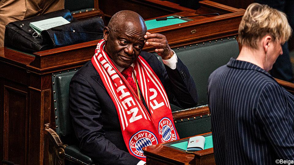 Proud dad in parliament: Pierre Kompany stands out wearing a Bayern scarf after his son's Champions League triumph