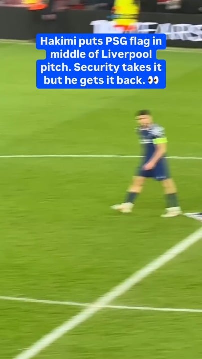 Hakimi puts PSG flag on Anfield centre circle last year, Steward takes it, Hakimi snatches it back