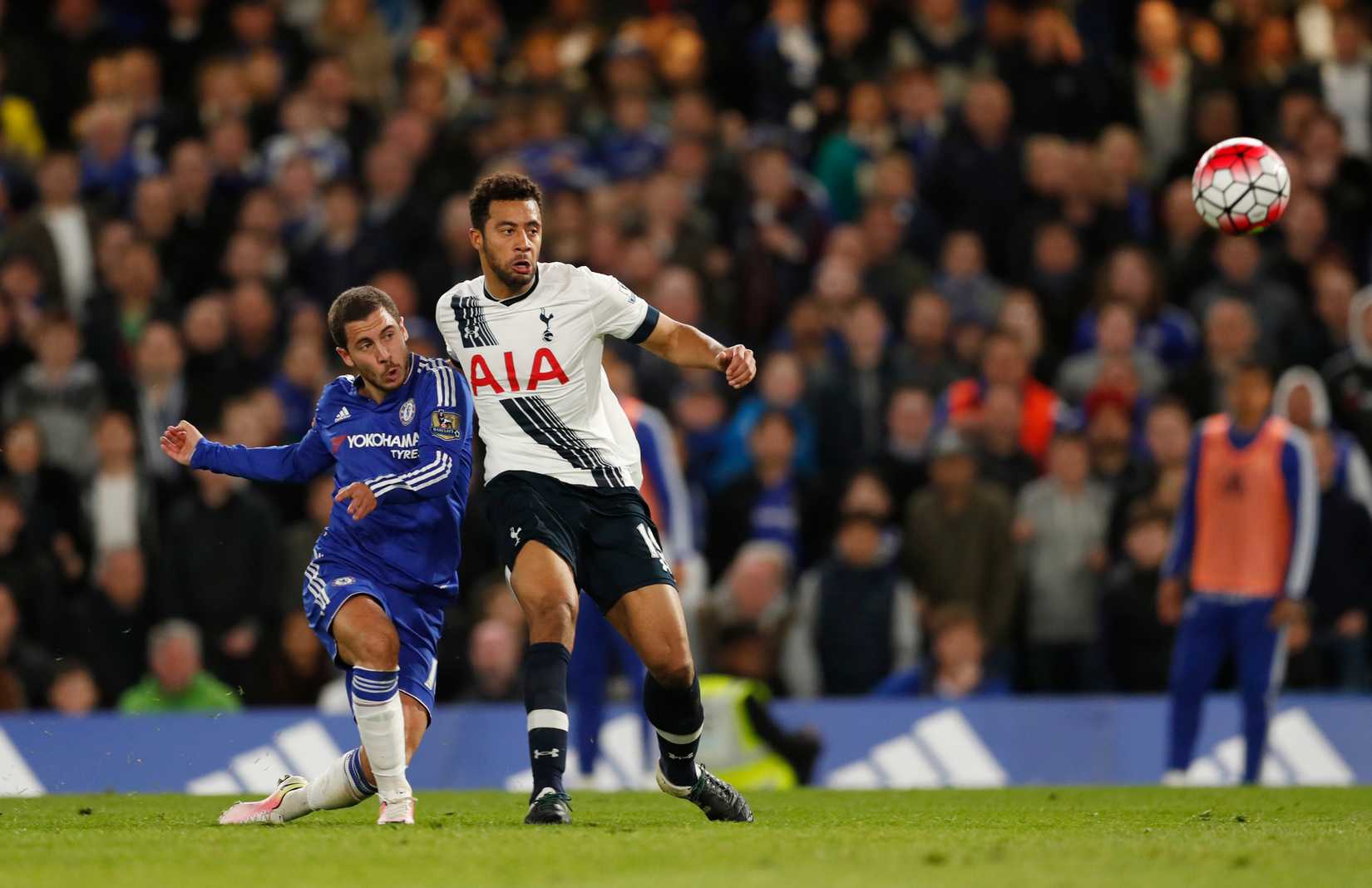 Chelsea's Eden Hazard beats Tottenham's Moussa Dembele and gets his shot away.