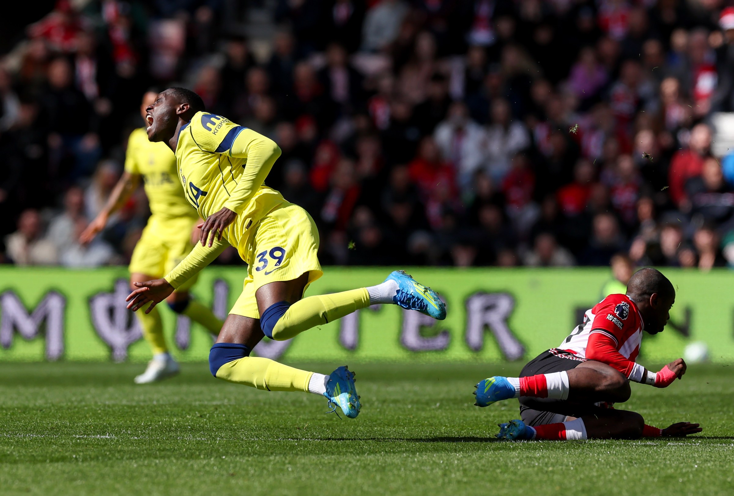 SUNDERLAND, ENGLAND - APRIL 12: Tottenham Hotspur’s Randal Kolo Muani as he is tackled by Sunderland’s Noah Sadiki during the Premier League match between Sunderland and Tottenham Hotspur at Stadium of Light on April 12, 2026 in Sunderland, United Kingdom. (Photo by Lee Parker - CameraSport via Getty Images)
