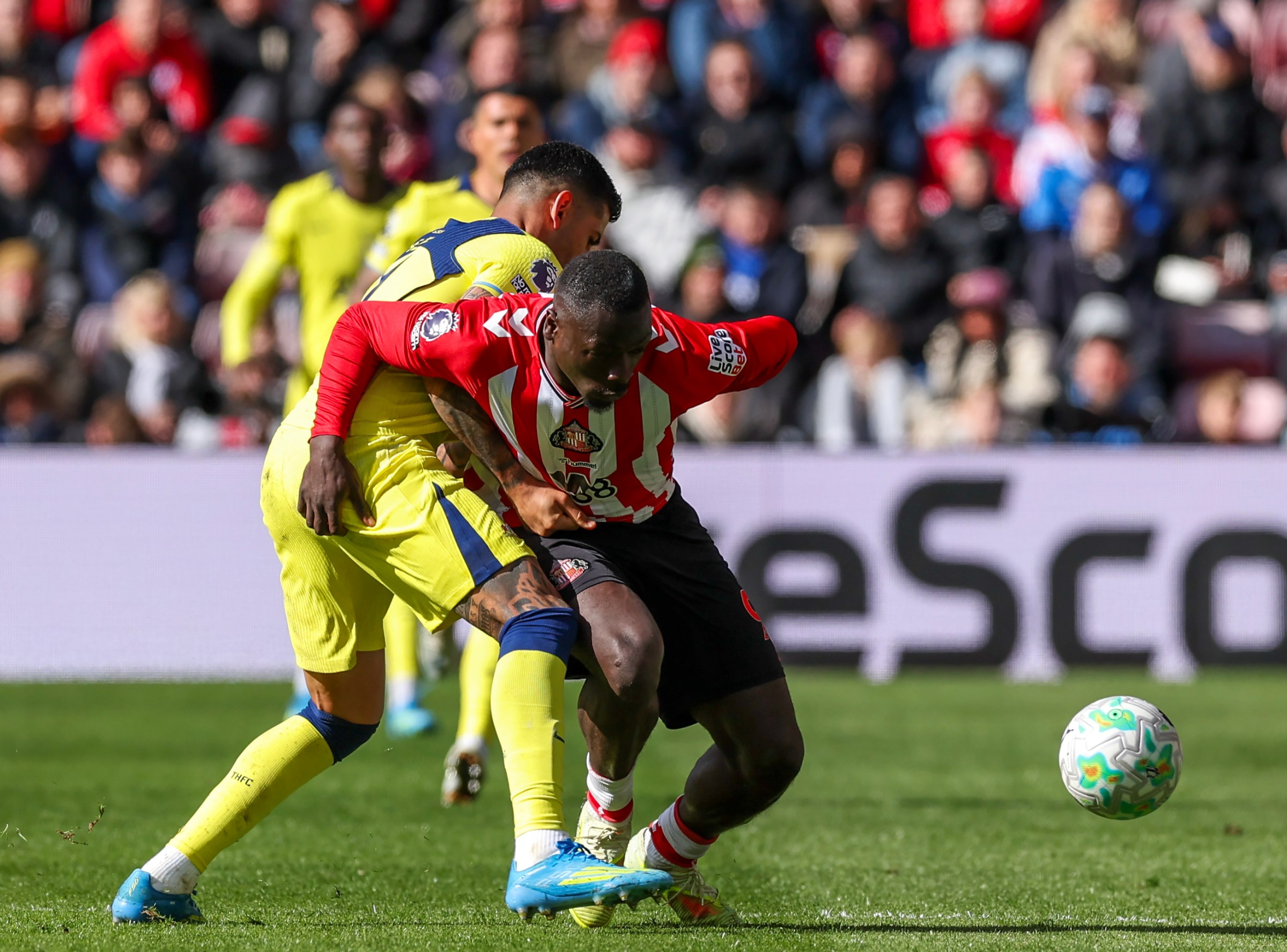 SUNDERLAND, ENGLAND - APRIL 12: Sunderland’s Brian Brobbey holds off the challenge from Tottenham Hotspur’s Cristian Romero during the Premier League match between Sunderland and Tottenham Hotspur at Stadium of Light on April 12, 2026 in Sunderland, United Kingdom. (Photo by Lee Parker - CameraSport via Getty Images)