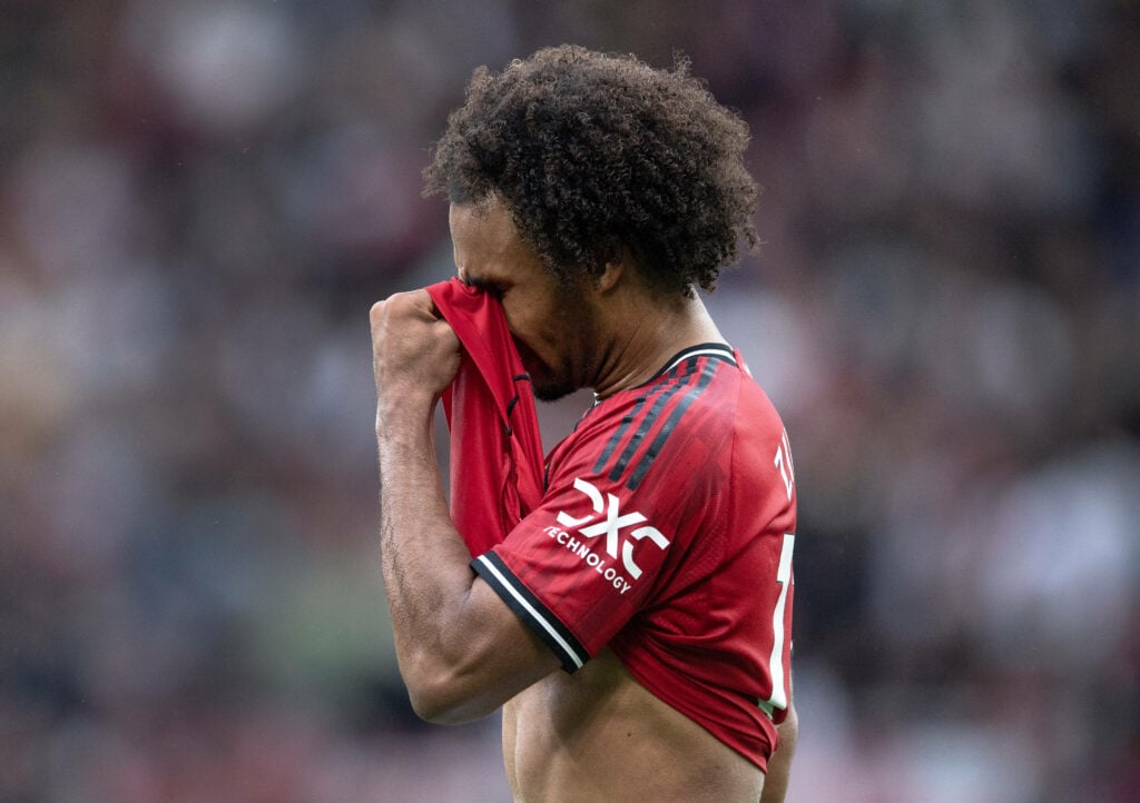 Joshua Zirkzee looks dejected in a Manchester United shirt