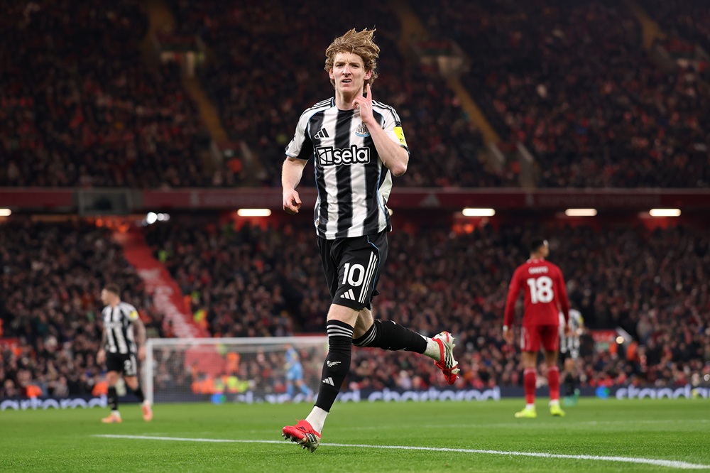 Anthony Gordon of Newcastle United celebrates scoring his team's first goal during the Premier League match between Liverpool and Newcastle United ...