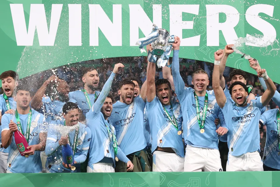 Manchester City lift the trophy during the Carabao Cup Final match between Arsenal and Manchester City