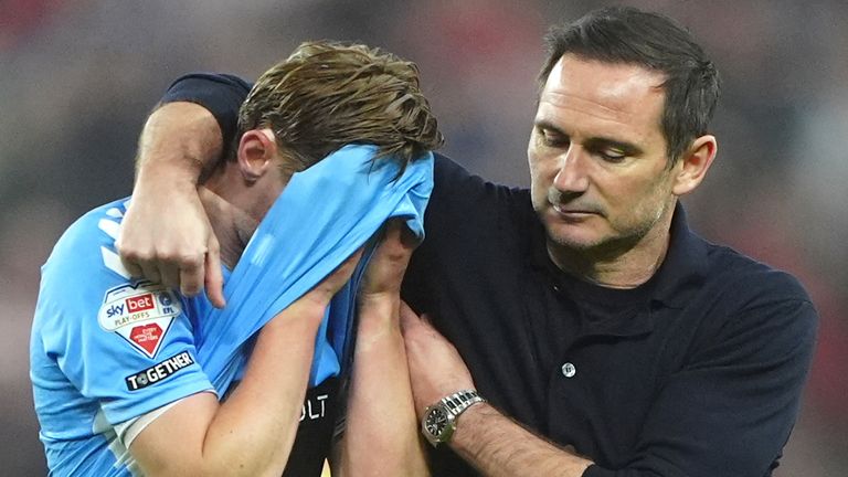 Coventry head coach Frank Lampard consoles Jack Rudoni.