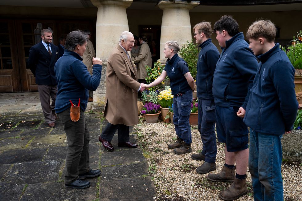 The King greeting Highgrove Garden trainees and work experience students Hannah, Ned, Maurice and Alfie, watched by Sir David Beckham