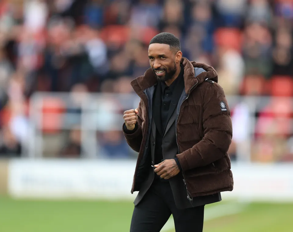 Woking manager Jermain Defoe celebrates their side's first goal of the game during the Enterprise National League match at Laithwaite Community Stadium