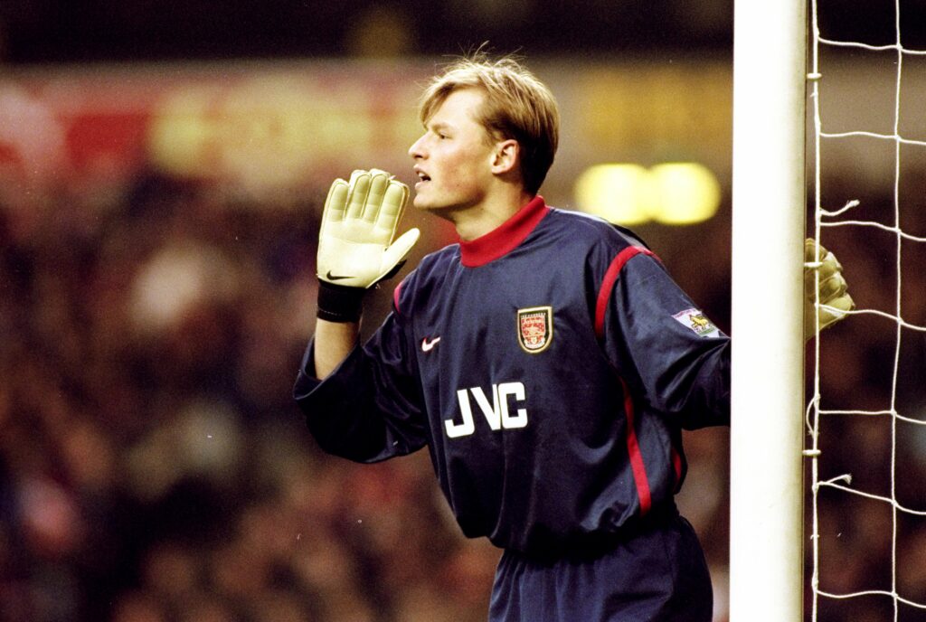 1999, Alex Manninger in the Arsenal goal cups his gloved had to his mouth as he shouts instructions