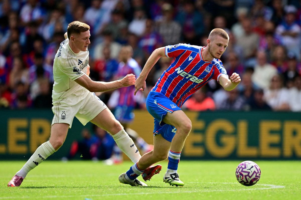 Nottingham Forest's Scottish midfielder #08 Elliot Anderson fouls Crystal Palace's English midfielder #20 Adam Wharton during the English Premier League football match between Crystal Palace and Nottingham Forest at Selhurst Park in south London on August 24, 2025. (Photo by Ben STANSALL / AFP) / RESTRICTED TO EDITORIAL USE. No use with unauthorized audio, video, data, fixture lists, club/league logos or 'live' services. Online in-match use limited to 120 images. An additional 40 images may be used in extra time. No video emulation. Social media in-match use limited to 120 images. An additional 40 images may be used in extra time. No use in betting publications, games or single club/league/player publications. / (Photo by BEN STANSALL/AFP via Getty Images)