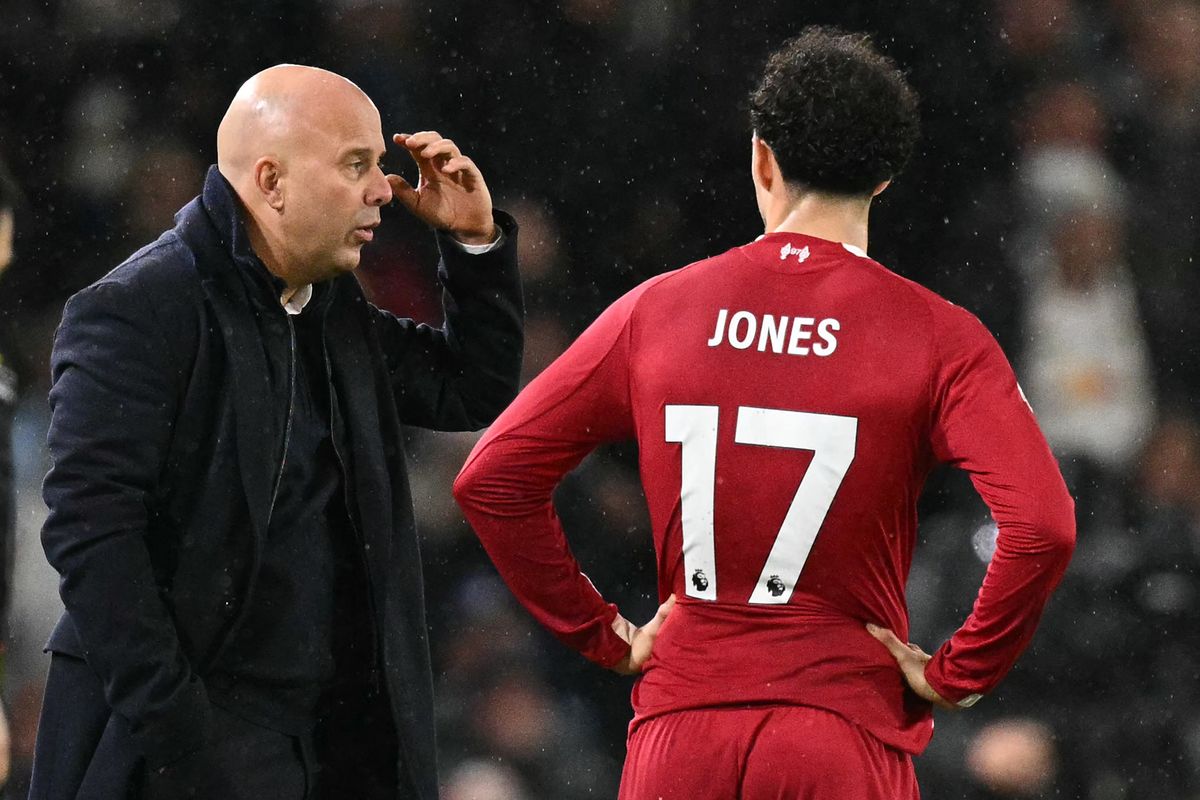 Liverpool head coach Arne Slot with midfielder Curtis Jones